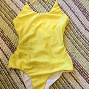 Beautiful and bright yellow one piece bathing suit. Very unique and small fit